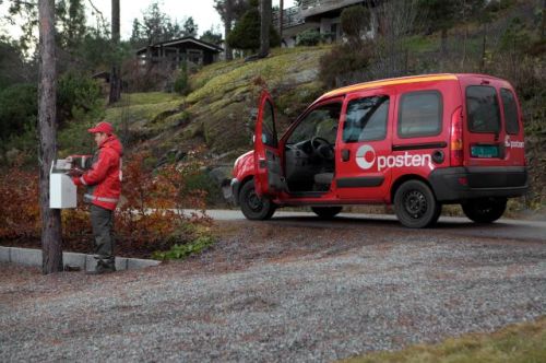 Mail carrier making a delivery