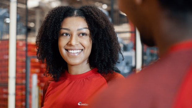 Female employee smiles