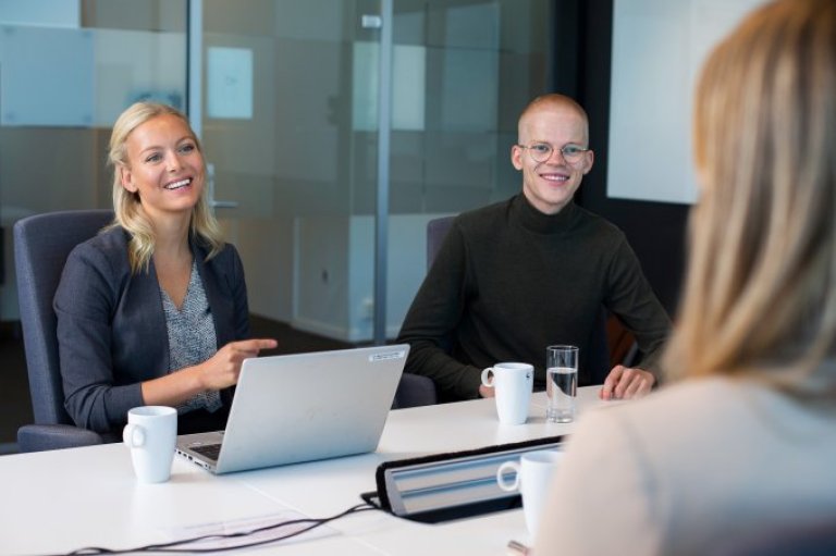 Trainees in a meeting room.jpeg